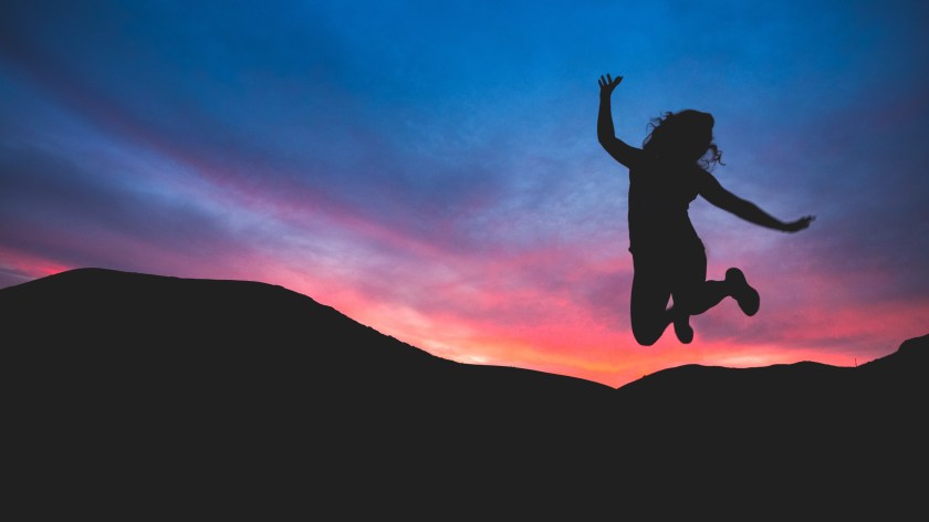 jumping with sunset unsplash