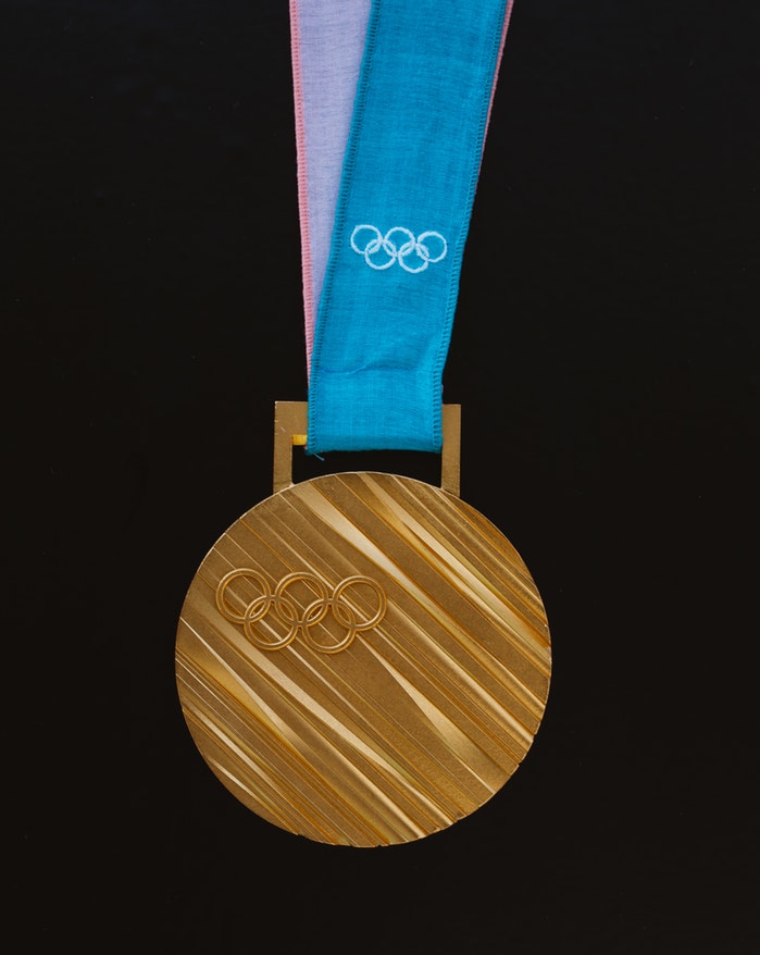 photo-1511406471420-feeac25c74c7 unsplash olympic gold metal